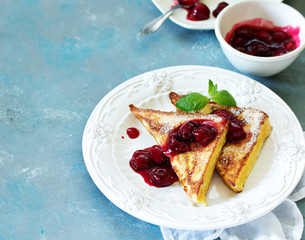 French toast with cherry sauce.