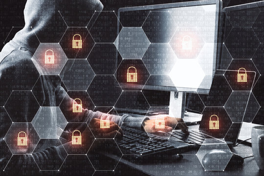 Cyber attack in process with hacker using laptop and computer and digital security icons in cells.Double exposure. - Powered by Adobe