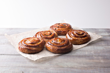 sweet pastries on a baking sheet. cakes on a wooden background