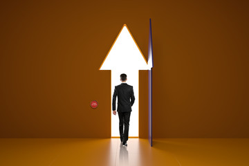 Personal growth concept with businessman walking through arrow door.