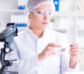 Female scientist researcher conducting an experiment in a labora