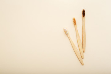 Eco-friendly bamboo tooth brush. Zero waste set on light beige natural background. Flat lay style.