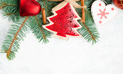 Christmas or New Year decoration background: tree branches, colorful glass balls and glittering stars, top view, copy space