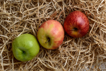 diagonal composition of three fresh apples on chips