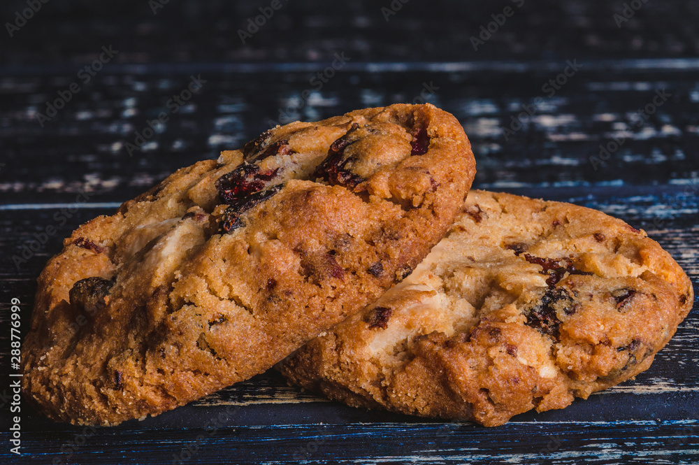 Wall mural Close up of two cookies on a wooden table