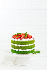 Cake with spinach, cream and strawberries. Valentine's Day.