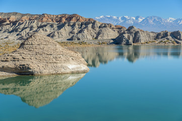 Dry desert badlands at the Lago Cuesta del Viento reservoir in San Juan, Argentina