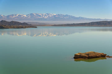 Dry desert badlands at the Lago Cuesta del Viento reservoir in San Juan, Argentina