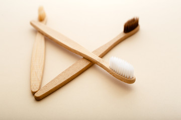 Eco-friendly bamboo tooth brush. Zero waste set on light beige natural background. Flat lay style.