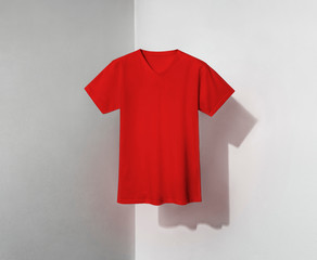 red t-shirt for man on shadowed background