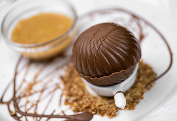 Melting chocolate sphere with caramel cream