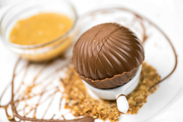 Melting chocolate sphere with caramel cream