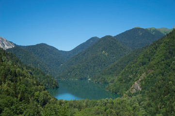 Obraz na płótnie Canvas Panoramic view on mountain lake in front of mountain range.