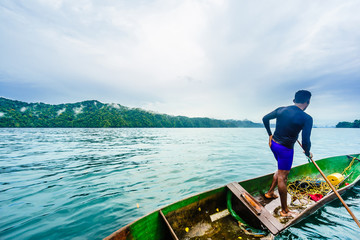 View on indigenou man on dugout canoe in national park Utria next to Nuqui, Colombia