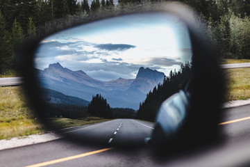 view from the side mirror of a car