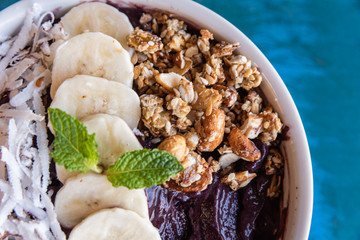 Açaí in the bowl with coconut banana mint and other ingredients