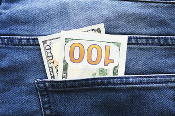 USA Dollars in a jeans pocket, closeup.