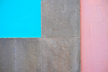 Sandstone, blue and pink wall detail.