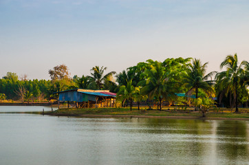 Fototapeta na wymiar Beautiful small houses near lake in jungle, Thailand