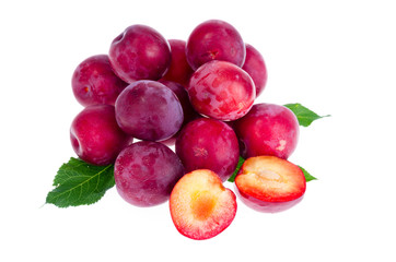 Heap of sweet red plums isolated on white background