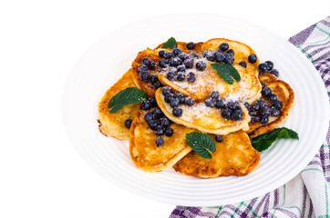 Tasty sweet pancakes with sugar and blueberries