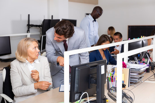 Angry boss blaming adult  female office worker