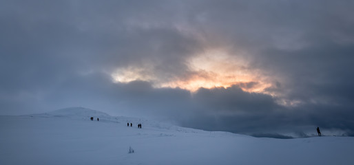 Fototapeta na wymiar People walking towards Storsteinen mountain summit