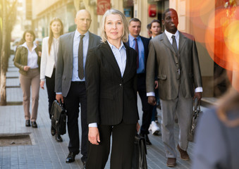 Fototapeta premium Mature business woman walking on street