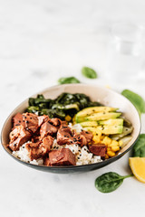 Vegan healthy bowl with rice, salad and jackfruit on dark backround