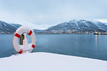 Lifebuoy covered in snow