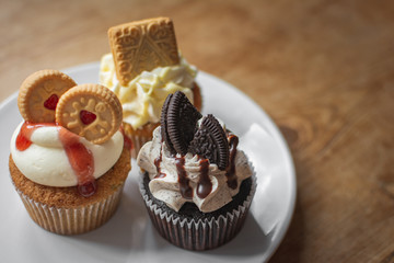 Fancy biscuit cupcakes on plate with spoon