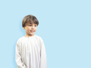 Muslim boy in a dress , isolate background