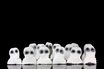 Halloween ghost sweets in a group