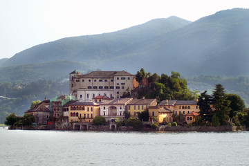 Fototapeta premium Orta San Giulio, Orta Lake, Piedmont, Italy the Island of San Giulio with convent and park