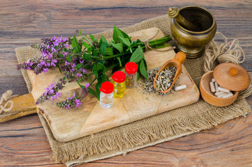 Fototapeta na wymiar Pills and oil from medicinal plants. Photo