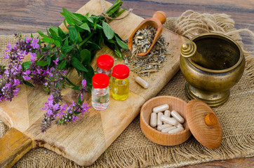 Pills and oil from medicinal plants. Photo