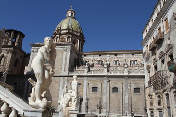 Fototapeta na wymiar Palermo, Italy - June 29, 2016: The pretoria fountain built in 1554 by Francesco Camilliani