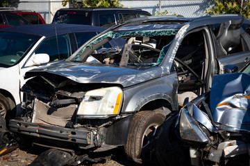 Total loss car after experiencing crash; extensive damage and airbags deployed.