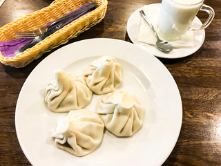 Dishes of Georgian cuisine. Khinkali with meat on plate