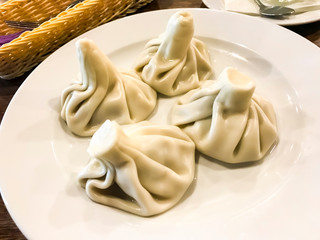 Dishes of Georgian cuisine. Khinkali with meat on plate