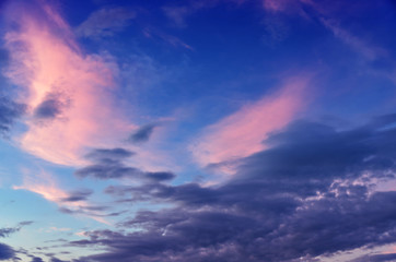 Naklejka na ściany i meble Dramatic sunset and sunrise sky with beautiful pink, yellow and blue clouds