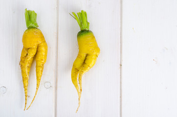 Ugly shaped vegetables, food. Deformed  fresh organic carrots. Misshapen produce.