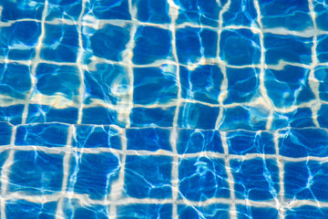 Blue color water in swimming pool rippled