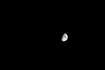 Closeup night sky half moon