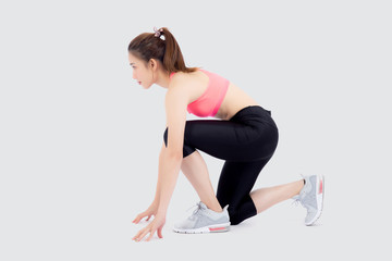 Fototapeta premium beautiful young asian woman slim start running isolated on white background, asia girl is confident workout cardio with run for strong, female ready to exercise, activity for health concept.