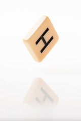 Alphabet H word block with white background.