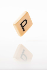 Alphabet P word block with white background.