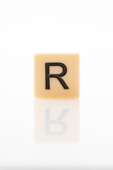 Alphabet R word block with white background.