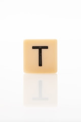 Alphabet T word block with white background.