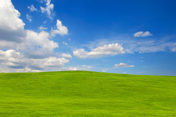 Fototapeta premium green hill on blue sky background